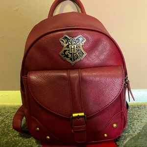 Burgundy mini backpack. Harry Potter symbol.